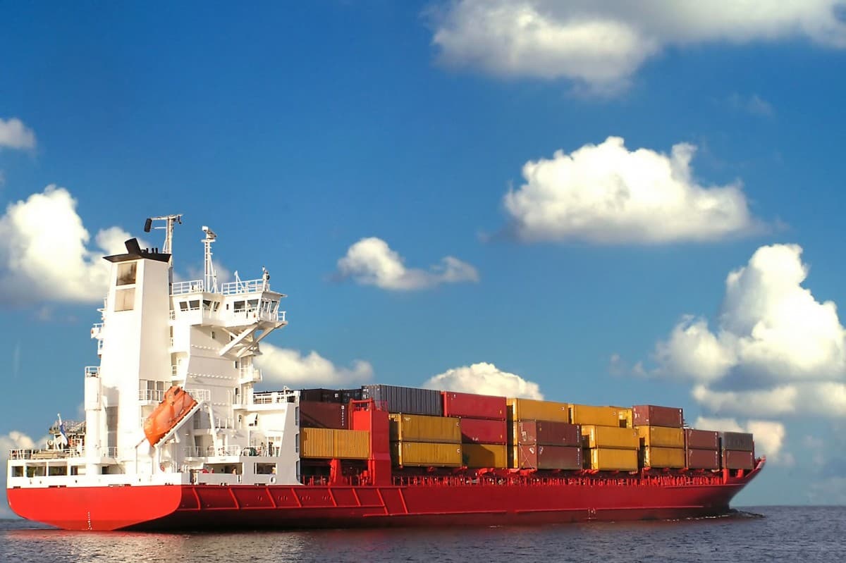 Cargo vessel moving freight containers through open water
